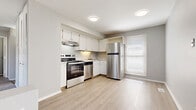 Located at 44 Eagle Ct in Wilkes-Barre, Pennsylvania, this two-story, two-bedroom, one-bathroom home offers a practical and well-maintained layout across two levels. The main living floor hosts the majority of the space, including the kitchen, both bedrooms, and the full bathroom.

The kitchen is a standout feature, finished with light hardwood-style flooring, crisp white cabinetry, and a full suite of stainless steel appliances including a refrigerator, electric range, and dishwasher. A window allows natural light to brighten the space, enhancing the clean, modern aesthetic.

Both bedrooms are carpeted in neutral tones and painted in soft gray, creating a calm and restful atmosphere. The generously sized primary bedroom includes a large bi-fold closet that spans much of one wall, offering substantial storage. A wall sconce adds a subtle decorative touch. The second bedroom is similarly sized and features its own window for natural light and a floor vent for climate control.

The bathroom is clean and functional, featuring a full tub-shower combination with a white surround, a vanity, and light hardwood-style flooring that ties in with the rest of the home.

Overall, the home presents a consistent, neutral palette throughout, making it a versatile and move-in ready space.
