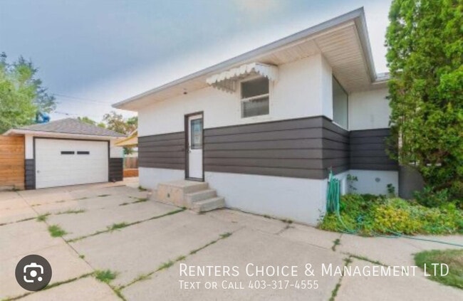 Building Photo - Pet Friendly Suite with Fenced Yard + Driveway Parking