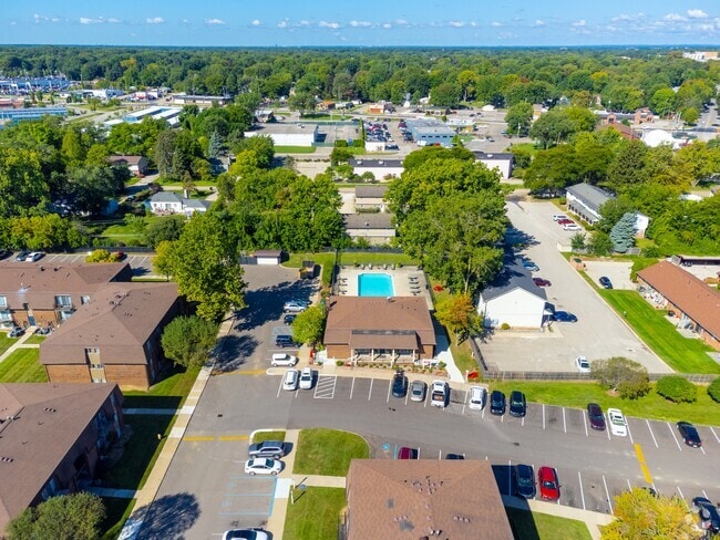 Aerial view with Pool at Knottingham Apartments in Clinton Township, MI - Knottingham Apartments
