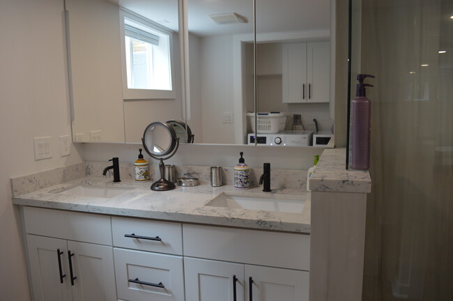 Bathroom with double vanity and cabinets - 919 NW 97th St