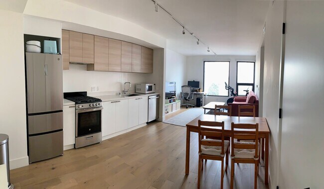 living room/kitchen with gas stove and dishwasher - 719 Larkin St