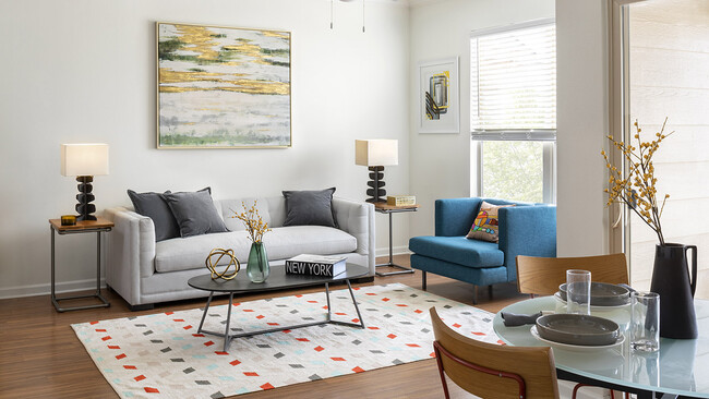 Apartment Living Room and Dining area with wood floors. - Griffis Fitzsimons South