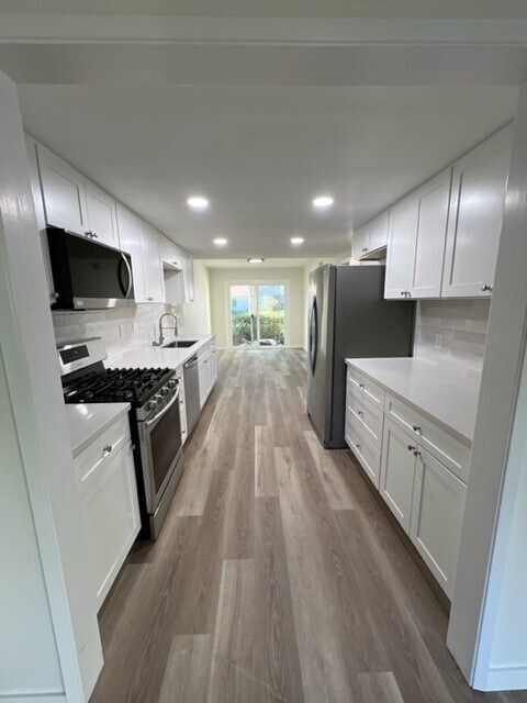 Brand new remodeled kitchen looking toward the dining room and back slider - 437 Vista Suerte