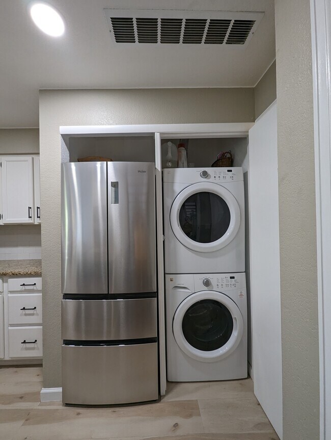 Stackable and full size laundry machines are conveniently located in the unit. - 842 S Vance St