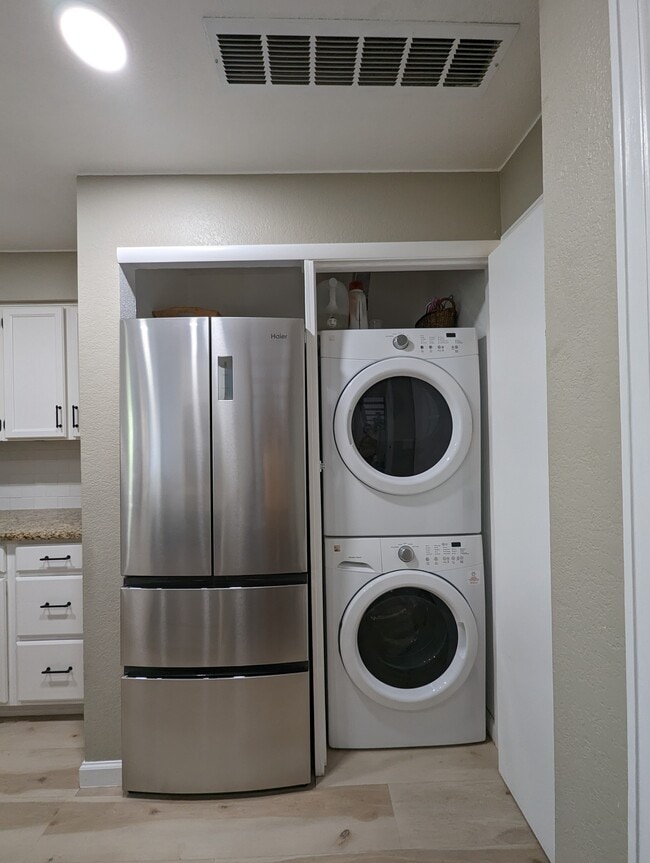 Stackable and full size laundry machines are conveniently located in the unit. - 842 S Vance St