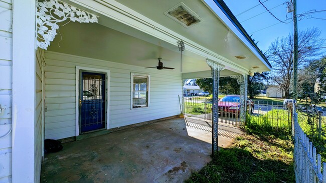 covered carport with security fence - 512 Rome St