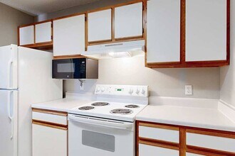 Our kitchens feature plenty of cabinet storage. - Northbrook Apartments