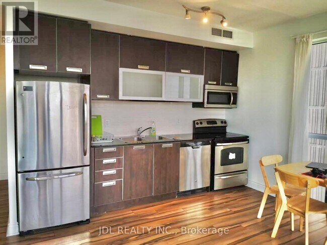 Building Photo - 28-2528 Ted Rogers Way