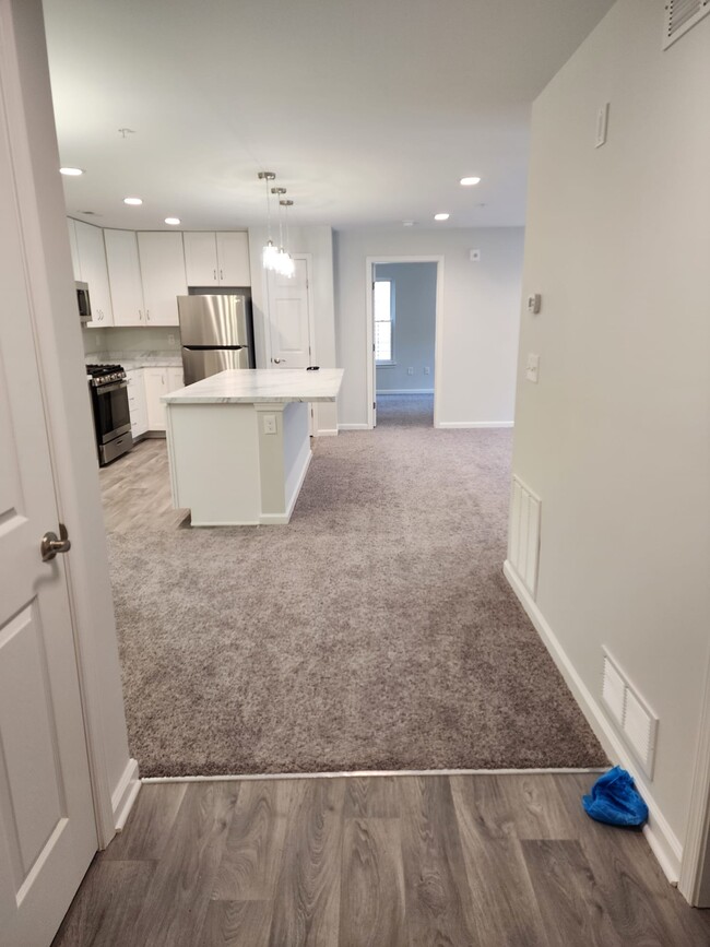 Kitchen view from entry hallway - 13111 Millhaven Pl