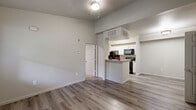 Located at 1325 W Tharpe St in Tallahassee, FL, this 2-bedroom, 2-bathroom unit offers a well-planned single-floor layout designed for comfortable everyday living. The open-concept living and dining area is finished with durable wood-style flooring and neutral tones throughout, creating a bright and cohesive atmosphere. Elevated ceilings in the main living space add a sense of openness beyond the unit's footprint.

The kitchen features white shaker-style cabinetry, granite-look countertops, and black appliances including a refrigerator, range, and built-in microwave. A breakfast bar connects the kitchen to the living and dining area, making it ideal for casual meals or entertaining. The kitchen also provides access to additional storage.

Both bedrooms are carpeted for comfort and receive natural light through window blinds with views of surrounding greenery. The primary bedroom includes its own closet, while a second closet provides additional storage. Each bathroom is finished with wood-look tile flooring, white vanities with brushed nickel hardware, and a full tub-shower combination.

Completing the layout is a dedicated laundry area, adding everyday convenience. The unit's clean finishes, functional design, and thoughtful use of space make it a practical and comfortable residence.