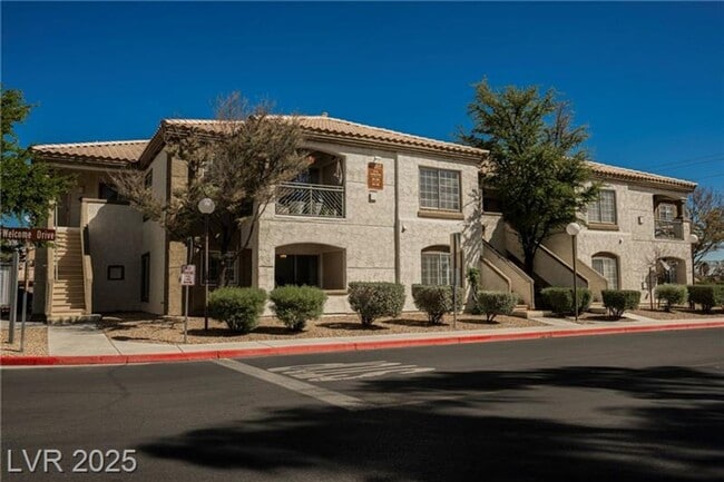 Building Photo - Stylish & Updated Condo with 2-Car Garage ...