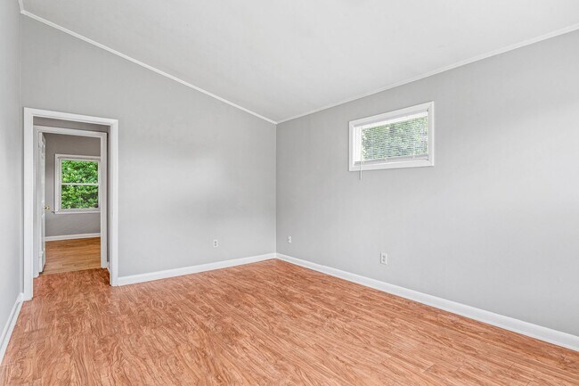 Building Photo - NE – Desirable Neighborhood, Brick Home, Wood/Laminate Flooring, Vaulted Ceilings, Carport, Fenced!