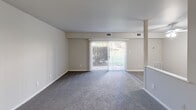 Located at 312 Shipley Rd in Wilmington, Delaware, this single-floor residence offers a well-organized layout with a clean, neutral aesthetic throughout. The living area is generously sized, finished with plush gray carpeting and anchored by a full-width sliding glass door fitted with vertical blinds, allowing natural light to fill the space and providing direct views of the outdoors. A half-wall partition separates the living area from the kitchen, creating an open yet defined flow between the two spaces. The kitchen is thoughtfully updated, featuring white shaker-style cabinetry, marble-look countertops, a double stainless steel sink, and a stylish mosaic tile backsplash in gray and white tones. Black appliances add a modern contrast to the bright cabinetry. The bedroom is well-proportioned, carpeted, and includes double closets with bifold doors, offering ample storage. A window provides natural light and ventilation. The bathroom is finished with light wood-look vinyl plank flooring, a white vanity, a full tub and shower combination with tiled surround, and clean white fixtures throughout. An entry foyer provides a welcoming transition into the main living space. The unit's neutral color palette and updated finishes create a move-in ready environment suitable for a variety of residents.
