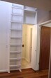 View of loft access ladder, bathroom and bedroom from kitchen. Washer/Dryer not pictured but provide as part of the lease. - 4409 Guadalupe Street