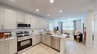 Located at 1610 Campbell Road in Houston's 77055 zip code, this well-appointed 2-bedroom, 2-bathroom single-floor residence offers a thoughtfully designed layout with modern finishes throughout. Light-toned hardwood-style flooring flows seamlessly across the entire space, complementing the clean, neutral color palette.

The open-concept kitchen and living area serves as the heart of the home. The kitchen is outfitted with white shaker-style cabinetry, a classic subway tile backsplash, granite countertops, and a full suite of stainless steel appliances, including a refrigerator, range, microwave, and dishwasher. A peninsula with seating provides additional prep space and a casual dining option. The adjoining living room is bright and welcoming, featuring large windows with blinds and curtains, a ceiling fan, and recessed lighting.

Both bedrooms are comfortably sized, with the primary bedroom offering natural light through a large window and direct access to one of the two well-proportioned walk-in closets, each equipped with wire shelving systems for versatile storage. The bathrooms feature granite-topped vanities with undermount sinks and tiled walk-in showers. The overall ambiance is clean, modern, and move-in ready.