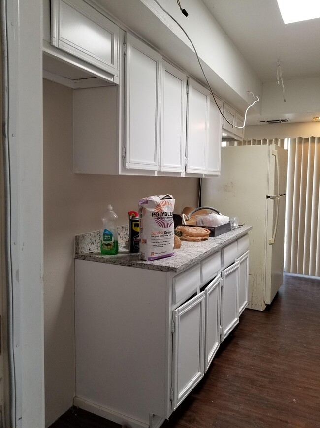 Coming in from the garage. Stove will be in space on the left - 5570 Aspen Valley St