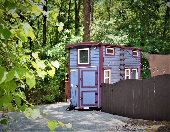 Tiny Home with private deck among the trees on one side and relaxing patio garden complete with fire pit and hammock on the other - a true oasis - 104 Hillcrest Ave