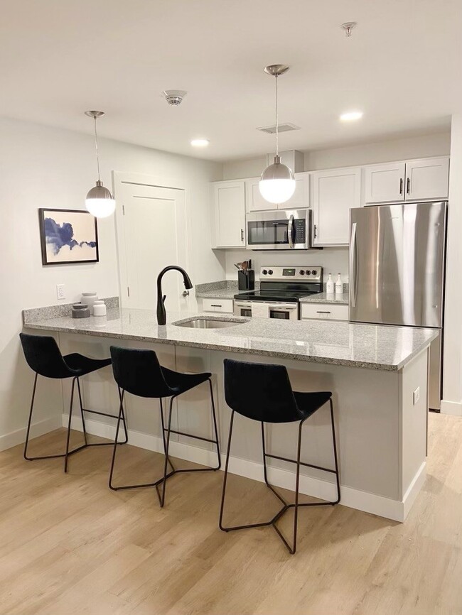 Sleek, modern kitchens, with granite and stainless steel! - Air City Lofts