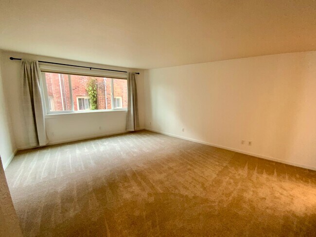 Building Photo - 1,300+ Sq Ft 2BR Condo w/ Parking, W/D & Utilities Included | $1,000 Move-In Credit