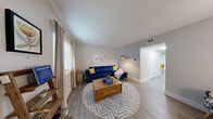Located at 1677 Rosado Dr in Saint Louis, MO, this two-story home offers a well-organized layout spread across two floors. The main level features a bright and welcoming living room with light wood-style flooring, neutral gray walls, and natural light from multiple windows. The kitchen is thoughtfully designed with crisp white shaker cabinets, a gray subway tile backsplash, white countertops, and a full suite of stainless steel appliances. Adjacent to the kitchen, the dining area opens to the outdoors through a sliding glass door, bringing in generous natural light and a connection to the exterior. A half bathroom on the main level adds everyday convenience. Upstairs, two bedrooms provide comfortable personal retreats, each featuring wood-style flooring, windows with outdoor views, and closet space. The primary bedroom includes a dedicated closet, while the secondary bedroom offers flexibility as a sleeping or flex space. A full bathroom serves the upper level. Throughout the home, consistent flooring, clean white trim, and a neutral color palette create a cohesive, move-in-ready aesthetic that is both functional and inviting.