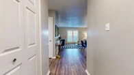 Located at 325–329 Crossroads Blvd in Bossier City, Louisiana, this single-floor, 2-bedroom, 1-bathroom home offers a thoughtfully designed layout that makes efficient use of its space. A welcoming hallway leads into the heart of the home, where wood-look flooring flows throughout the main living areas, creating a warm and cohesive aesthetic.

The living room is a standout feature, bathed in natural light through a set of French doors fitted with plantation shutters. Textured ceilings and neutral gray walls provide a versatile backdrop, while the open feel of the room makes it an inviting space for everyday living.

The kitchen is outfitted with white cabinetry, light quartz-style countertops, a stainless steel sink, and a range with overhead ventilation — offering a clean, functional workspace.

Both bedrooms are carpeted for comfort and feature built-in closets with bi-fold doors. Each room connects conveniently to the hallway, providing easy access to the shared bathroom, which showcases a marble-look quartz vanity top, white cabinetry, and wood-look flooring.

The overall ambiance of this home is bright and neutral, with a layout that balances practicality and comfort in a compact, well-organized footprint.