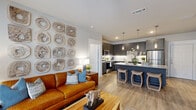 Located at 15915 Kingfield Dr in Houston, TX, this single-story, 3-bedroom, 2-bathroom home offers a well-designed open-concept layout that seamlessly connects the living, dining, and kitchen areas. Wood-look flooring runs throughout, lending warmth and continuity to the space.

The kitchen is a standout feature, boasting dark charcoal cabinetry with sleek hardware, granite countertops, stainless steel appliances, and a large central island with pendant lighting and bar seating — ideal for both cooking and entertaining. The living area is bright and inviting, with a ceiling fan, French doors that invite natural light, and direct access to the outdoors.

The primary bedroom is a comfortable retreat, featuring a ceiling fan, hardwood-style flooring, and a dedicated closet. The additional bedrooms offer similar finishes and natural light. Both bathrooms are appointed with dark cabinetry, granite vanity tops, and tiled tub-shower combinations.

The home also includes a dedicated laundry area and a closet for extra storage. Throughout the space, neutral tones and modern design choices create a clean, cohesive aesthetic. The layout is practical and efficient, making excellent use of the available footprint to deliver a comfortable and stylish living environment.