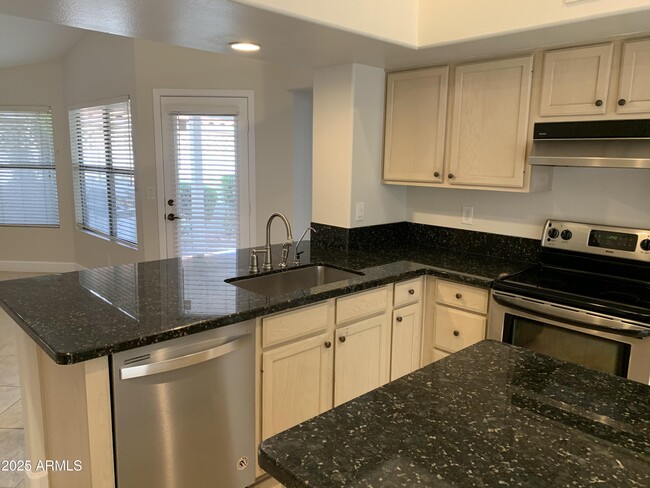 Building Photo - 8889 E Aster Dr