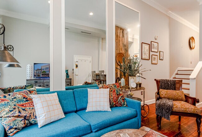 Another view of sitting area. Custom made couch that folds out into a bed. Ideal for guests. - 350 King St