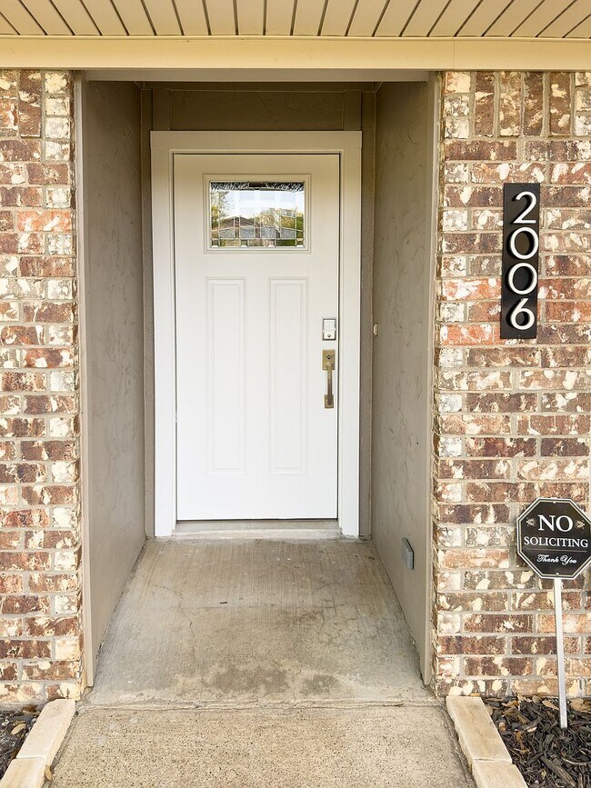 Front entry with Wi-Fi keypad smart lock and covered porch - 2006 Candle Ct