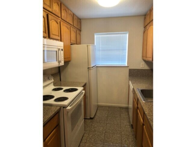 Building Photo - Available 2 bedroom, upstairs condo with f...