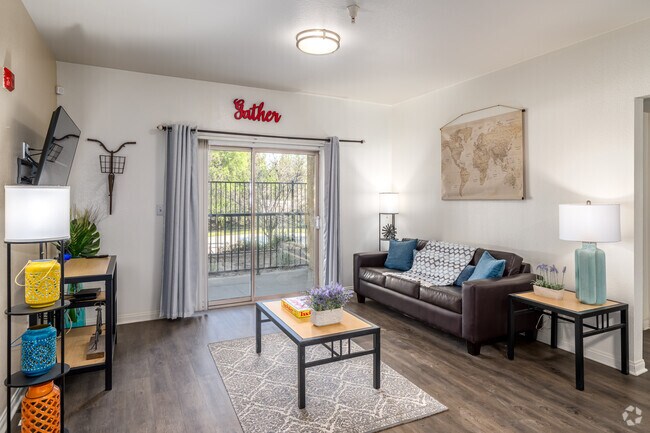 4BR, 4BA - 1,415SF - Living Room - GrandMarc at University Village Apartments