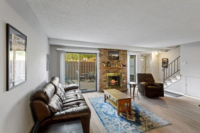 Wood burning fireplace and solid surface flooring on the main level - 4705 Cedar Lake Rd S