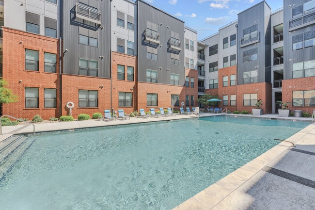 Resort Style swimming pool with lounge chairs - Steelyard