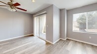 Located at 312 S 49th St in San Diego, CA, this contemporary multi-story home offers three bedrooms, five bathrooms, and a well-organized layout spread across four floors. Light wood-tone luxury vinyl flooring runs throughout, complemented by soft gray walls and crisp white trim, creating a clean, cohesive aesthetic.

The main living floor serves as the heart of the home, anchoring an open-concept kitchen and living area. The kitchen is outfitted with white shaker cabinetry, stainless steel appliances including a gas range, microwave, and refrigerator, a light quartz-topped island with seating, and recessed lighting. A ceiling fan enhances comfort in the adjoining living space.

The upper floors house three well-proportioned bedrooms, each finished with the same light flooring and neutral tones. The primary bedroom includes a sliding glass door leading to a private balcony with outdoor views, a ceiling fan, and ample natural light. Additional bedrooms feature windows with neighborhood views and wall-mounted mini-split HVAC units for individual climate control. Two closets provide convenient storage.

Five bathrooms serve the home, each featuring white vanities with quartz countertops and gold-toned hardware. Multiple staircases connect the floors efficiently. A hallway and dedicated staircase areas further enhance the home's functional flow, making this a well-appointed residence designed for modern living.