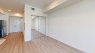 Located at 3518 Chesapeake Ave in Los Angeles, CA, this efficiently designed unit offers a thoughtfully organized single-floor layout that maximizes every square foot. Light-toned luxury vinyl plank flooring runs seamlessly throughout the space, lending a cohesive and contemporary feel.

The open living area is bright and airy, benefiting from a window that draws in natural light and creates an inviting atmosphere. A mirrored sliding-door closet in the sleeping area enhances the sense of space while providing practical storage.

The kitchen is a standout feature, outfitted with crisp white cabinetry, dark contrasting countertops, stainless steel appliances including a refrigerator, dishwasher, electric range, and microwave, as well as a deep single-basin sink with a modern pull-down faucet. Recessed lighting above the kitchen adds a polished touch and ensures excellent task illumination.

The bathroom continues the clean, neutral aesthetic with matching flooring, a shower with curtain, toilet, and a towel bar, all set within a neatly appointed space. A programmable smart thermostat is conveniently located just outside the bathroom, offering easy climate control. The overall design palette of whites and light neutrals gives the entire unit a fresh, modern character well-suited for comfortable urban living.