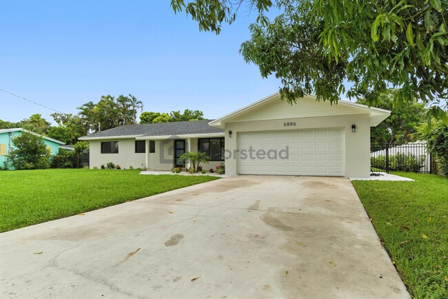 Foto del edificio - 6886 Tradewind Way