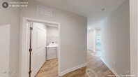 Located in Cary, NC, this single-story, 3-bedroom, 2-bathroom home features a clean, contemporary design with neutral tones and quality finishes throughout. The open-concept kitchen and living area serves as the heart of the home, showcasing a large center island with a bright quartz countertop, two-tone cabinetry pairing crisp white uppers with bold navy lowers, a white subway tile backsplash, and a full suite of stainless steel appliances. Light hardwood-style flooring flows through the main living areas, adding warmth and continuity. The primary bedroom offers hardwood-style flooring, a ceiling fan, and large windows that bring in generous natural light, complemented by a spacious walk-in closet with built-in wire shelving. The secondary bedrooms feature plush carpeting and bright windows with outdoor views. Both bathrooms are finished with clean, modern fixtures; one includes a soaking tub and shower combination clad in classic white subway tile. A dedicated laundry room houses a full-size side-by-side washer and dryer. With three closets providing ample storage and a thoughtfully designed floor plan, this home offers comfortable, functional living in a well-appointed single-level layout.