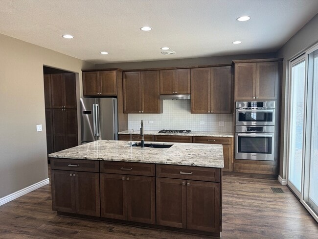 Photo - Greenbelt-Backed Wheatlands Home - Mountain Views, 3 Car Garage & Finished Basement