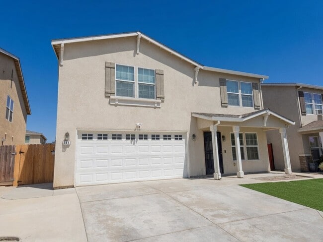 Photo - Spacious 4-Bedroom Home with Solar, Finished Garage, Large Pantry & Low-Maintenance Backyard in M...