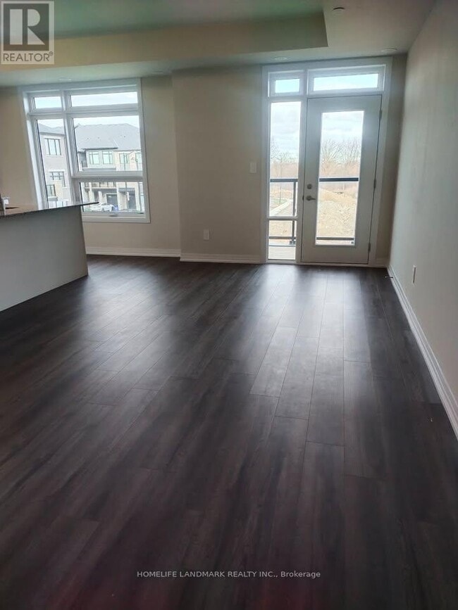 Building Photo - 103-1573 ROSE Way