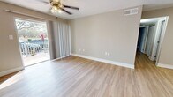 This contemporary 820 square foot apartment in Temple Terrace, FL offers a well-designed living space with two bedrooms and two bathrooms. The primary bedroom, measuring 180 square feet, provides ample space for comfort and relaxation. The apartment features a modern open-concept layout, enhancing the sense of spaciousness and flow between rooms.

Throughout the unit, updated finishes create a fresh and inviting atmosphere. The living area is bright and airy, with a ceiling fan and sliding glass doors leading to an outdoor space, allowing natural light to flood in. The kitchen boasts white cabinetry, granite countertops, and stainless steel appliances, offering both style and functionality.

Both bathrooms are equipped with modern fixtures, including vanities with granite countertops and large mirrors. The bedrooms feature neutral tones and wood-look flooring, creating a warm and versatile backdrop for personal decor. Ample closet space with wire shelving systems provides practical storage solutions.

The apartment's cohesive design is evident in the consistent use of light-colored walls, white trim, and wood-toned flooring throughout, creating a harmonious and contemporary living environment. With its thoughtful layout and modern amenities, this apartment offers a comfortable and stylish living space in a desirable Florida location.