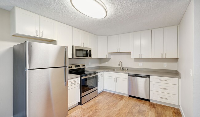 Updated kitchens with premium finishes are available for upgrade. - Laurel Crossing Apartment Homes