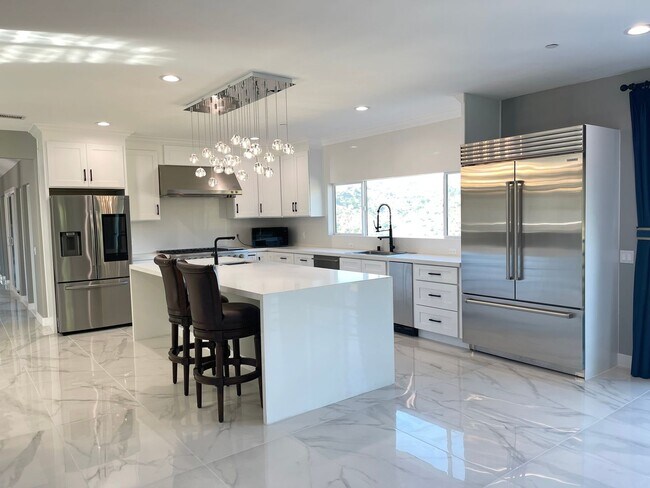 Building Photo - Modern Elegance Meets Scenic Privacy in Be...