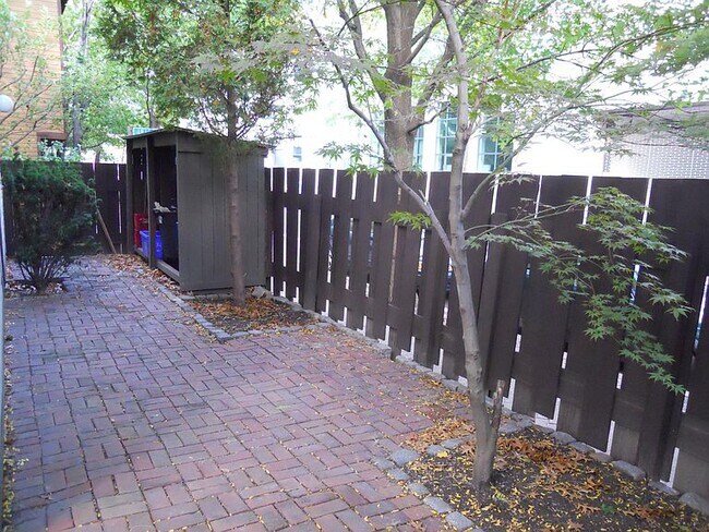 sideyard with firewood shed - 24 Lilac Ct