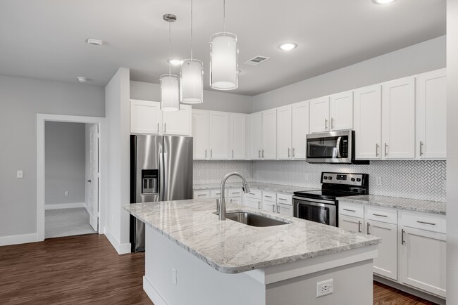 Modern kitchens with stone counter-tops and tile back-splash. - Windsor Castle Hills