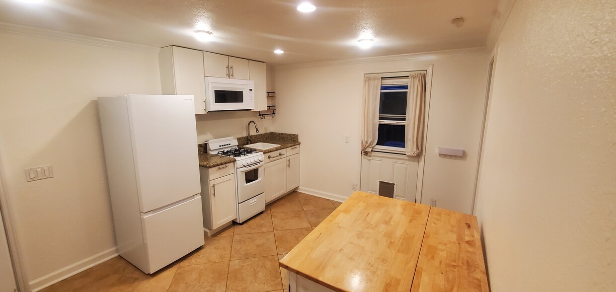 Full kitchen with new refrigerator - 152 Redfield Ave