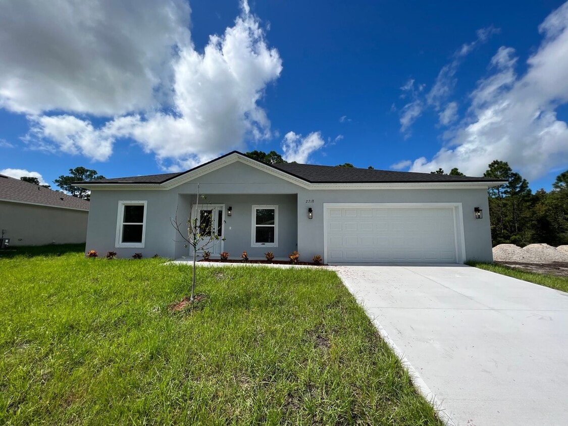 Foto principal - Wonderful 4 BD/2BA Home in Beautiful Palm ...