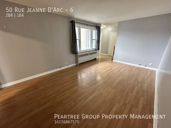 Photo du bâtiment - Joyful Jeanne-D'Arc-2 bed apartment for rent