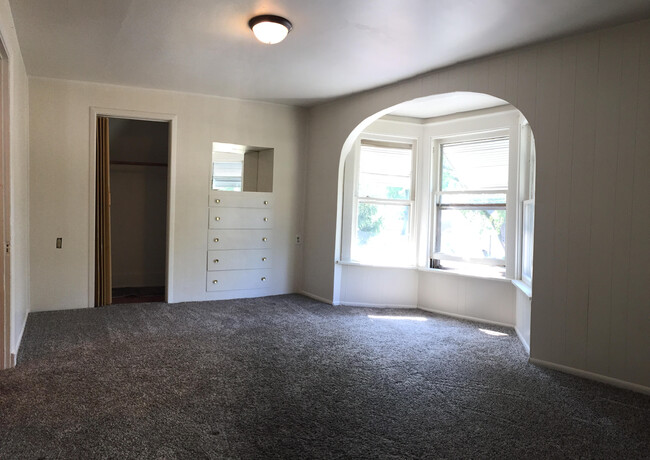 Living Rm w/ Built-in Storage and Closet - 1411 Portland Ave