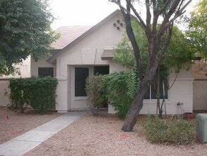 Building Photo - 6813 W Aire Libre Ave
